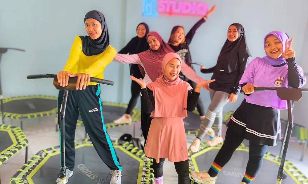 a group of women standing on a trampoline after excercise Trampoline Dance